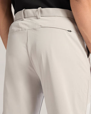 Close-up of beige pants with a white background