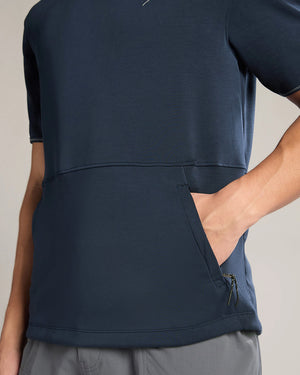 Navy blue athletic shirt worn by a person on a neutral background